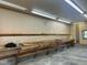 Functional garage interior featuring a workbench and storage shelves for projects and organization at 759 Wheeler Dr, Angier, NC 27501