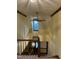 View of foyer hallway leading to a window with an overhead light and ceiling fan at 759 Wheeler Dr, Angier, NC 27501
