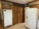 Kitchen with ample wooden cabinetry, and white appliances at 759 Wheeler Dr, Angier, NC 27501