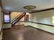 Open-concept living room featuring wood floors, staircase and decorative trim at 759 Wheeler Dr, Angier, NC 27501