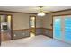 Open-concept living area providing access to a bathroom and the kitchen at 759 Wheeler Dr, Angier, NC 27501
