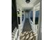 Covered porch featuring white pillars and railings, providing a charming and inviting entry to the home at 759 Wheeler Dr, Angier, NC 27501