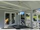 Inviting screened porch with a ceiling fan, offering a comfortable and breezy outdoor retreat at 759 Wheeler Dr, Angier, NC 27501