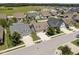 Aerial view of the home nestled in a vibrant neighborhood with ample community green spaces at 80 Scarlet Bell Dr, Youngsville, NC 27596