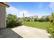 Back patio featuring a large concrete area and lush lawn at 80 Scarlet Bell Dr, Youngsville, NC 27596
