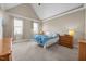 Bright bedroom with vaulted ceiling, plush carpet, two windows for natural light, and neutral walls at 80 Scarlet Bell Dr, Youngsville, NC 27596
