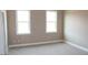 Spacious bedroom with two windows offering natural light at 80 Scarlet Bell Dr, Youngsville, NC 27596