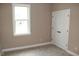 Bedroom featuring neutral walls, carpet, a window, and a double-door closet for storage at 80 Scarlet Bell Dr, Youngsville, NC 27596