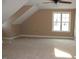 Bonus room with a vaulted ceiling, ceiling fan, and natural light at 80 Scarlet Bell Dr, Youngsville, NC 27596