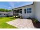 Beautiful backyard features a stone patio and a screened porch connected to the bright, modern home at 808 Shiloh Hills Dr, Fuquay Varina, NC 27526