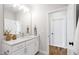 Stylish bathroom features a white vanity, modern fixtures, quartz countertop and tiled flooring at 808 Shiloh Hills Dr, Fuquay Varina, NC 27526