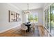 Elegant dining room with modern light fixture and large window at 808 Shiloh Hills Dr, Fuquay Varina, NC 27526
