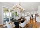 Open dining area adjacent to outdoor living space and a modern kitchen at 808 Shiloh Hills Dr, Fuquay Varina, NC 27526