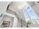 Bright entryway features large windows, chandelier, and modern railing at 808 Shiloh Hills Dr, Fuquay Varina, NC 27526