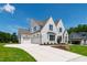 Beautiful home with large driveway and three-car garage on a well-manicured lawn at 808 Shiloh Hills Dr, Fuquay Varina, NC 27526