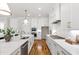 Well-appointed kitchen featuring stone countertops, stainless appliances, and ample cabinet space at 808 Shiloh Hills Dr, Fuquay Varina, NC 27526
