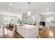 Spacious kitchen and dining area filled with natural light and hardwood flooring at 808 Shiloh Hills Dr, Fuquay Varina, NC 27526