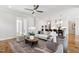 Bright living room with hardwood floors open to the modern kitchen at 808 Shiloh Hills Dr, Fuquay Varina, NC 27526