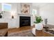 Cozy living room featuring a fireplace, built-in cabinets, and elegant decor at 808 Shiloh Hills Dr, Fuquay Varina, NC 27526