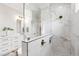 This is a closer view of the marble shower in the main bathroom showing glass partition and bronze hardware at 808 Shiloh Hills Dr, Fuquay Varina, NC 27526