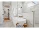 This is a close-up of the main bathroom soaking tub with a view into the shower and closet at 808 Shiloh Hills Dr, Fuquay Varina, NC 27526