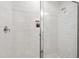Sleek shower featuring tile walls and a built-in niche for storage, offering a modern design at 808 Shiloh Hills Dr, Fuquay Varina, NC 27526