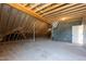 Unfinished attic shows exposed framework, offering potential for customization at 808 Shiloh Hills Dr, Fuquay Varina, NC 27526