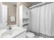 Clean bathroom featuring a vanity, toilet, and shower with a stylish white curtain at 8513 Buscot Ct, Raleigh, NC 27615