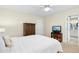 Bedroom with a tv, wardrobe and doorway that leads into the bathroom at 8513 Buscot Ct, Raleigh, NC 27615