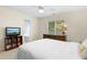 This light-filled bedroom features a large window and a cozy, inviting bed at 8513 Buscot Ct, Raleigh, NC 27615
