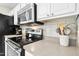 Well-equipped kitchen features stainless steel appliances and ample counter space at 8513 Buscot Ct, Raleigh, NC 27615