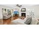 Bright living room with fireplace, hardwood floors, and comfortable seating area at 8513 Buscot Ct, Raleigh, NC 27615