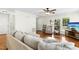 Open-concept living room with hardwood floors and access to the dining area at 8513 Buscot Ct, Raleigh, NC 27615