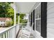 Inviting front porch with white rocking chairs and view of the neighborhood at 8513 Buscot Ct, Raleigh, NC 27615