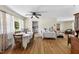 Bright dining room featuring hardwood floors and an open layout to the living area at 905 Aversboro Rd, Garner, NC 27529