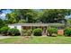 Charming brick ranch home with mature landscaping and inviting covered front porch at 905 Aversboro Rd, Garner, NC 27529