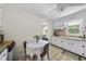 Kitchen nook with white cabinets and checkered floors with natural sunlight at 905 Aversboro Rd, Garner, NC 27529