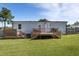 Home exterior featuring a wood deck and fenced yard, perfect for outdoor entertaining at 10 Wilders Ln, Louisburg, NC 27549