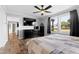 Cozy bedroom with a comfortable bed, a ceiling fan, and plenty of natural light at 10 Wilders Ln, Louisburg, NC 27549