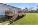 Home exterior with a spacious wooden deck, perfect for entertaining and enjoying the backyard view at 10 Wilders Ln, Louisburg, NC 27549