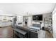 Spacious living room with modern gray furniture, an adjacent fireplace and an open floor plan at 10 Wilders Ln, Louisburg, NC 27549
