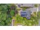 Aerial view of a landscaped home with solar panels on roof at 1007 W Markham Ave, Durham, NC 27701