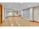Finished basement offers an open layout with built-in shelving and access to the staircase at 1007 W Markham Ave, Durham, NC 27701