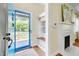 Bright entryway with custom storage space and access to a charming landscaped front yard at 1007 W Markham Ave, Durham, NC 27701