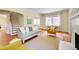 Open living room with hardwood floors, fireplace, and a staircase leading to the upper level at 1007 W Markham Ave, Durham, NC 27701
