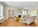 Inviting living room with hardwood floors, fireplace, and lots of natural light at 1007 W Markham Ave, Durham, NC 27701