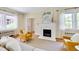 Bright living room with hardwood floors, fireplace, and lots of natural light at 1007 W Markham Ave, Durham, NC 27701