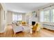 Spacious living room featuring hardwood floors, a fireplace, and plenty of natural light at 1007 W Markham Ave, Durham, NC 27701
