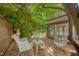 Secluded outdoor patio with brick flooring and comfortable seating area at 1007 W Markham Ave, Durham, NC 27701