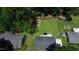 Aerial view of a backyard featuring a lush lawn, a patio, and play set at 1016 Buckhorn Rd, Garner, NC 27529